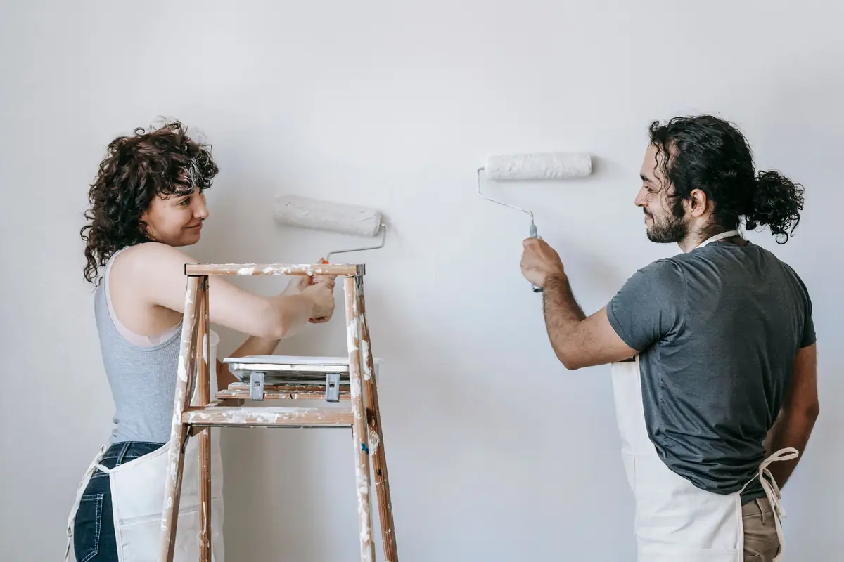 People painting a wall together — painting help in Reno