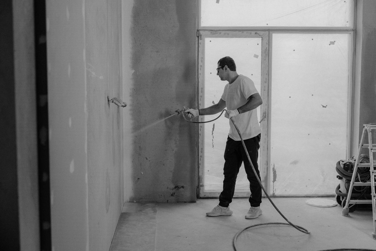 Painter working on a building exterior
